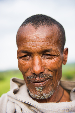 AKSUM, ETHIOPIA - SEP 26, 2011: Portrait of an unidentified Ethiopian old man in Ethiopia, Sep.26, 2011. People in Ethiopia suffer of poverty due to the unstable situationのeditorial素材