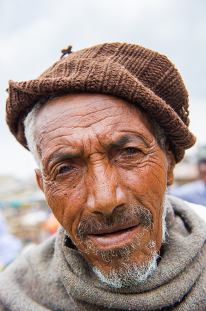 OMO VALLEY, ETHIOPIA - SEP 22, 2011: Unidentified Ethiopian man wearing a hat in Ethiopia, Sep.22, 2011. People in Ethiopia suffer of poverty due to the unstable situationのeditorial素材