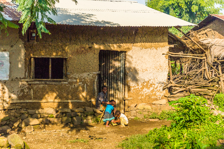 OMO, ETHIOPIA - SEPTEMBER 21, 2011: Unidentified Ethiopian woman and children in the street. People in Ethiopia suffer of poverty due to the unstable situationのeditorial素材