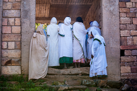 OMO, ETHIOPIA - SEPTEMBER 21, 2011: Unidentified Ethiopian woman in white tissue. People in Ethiopia suffer of poverty due to the unstable situationのeditorial素材