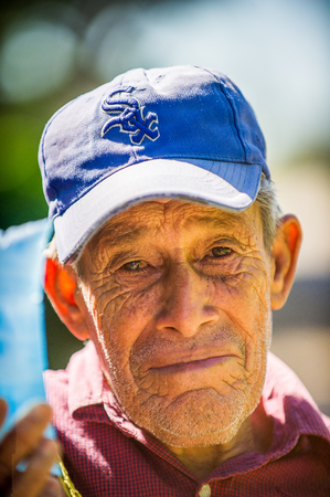 MANAGUA, NICARAGUA - JAN 6, 2012: Unidentified Nicaraguan man in a blue hat. 69% of Nicaranguan people belong to the Mestizo ethnic groupのeditorial素材