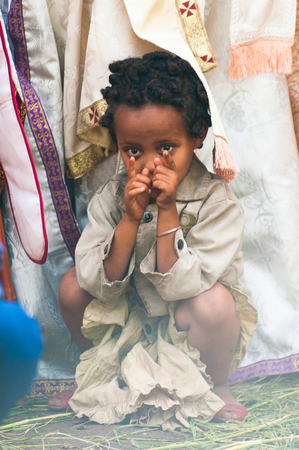 LALIBELA, ETHIOPIA - SEP 27, 2011:  Unidentified Ethiopian little girl during the Meskel festival performance in Ehtiopia, Sep 27, 2011. Meskel commemorates the finding of the True Crossのeditorial素材