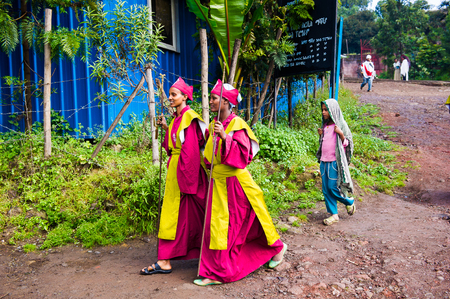 LALIBELA, ETHIOPIA - SEP 27, 2011: Unidentified Ethiopian people in bright clothes come to the Meskel festival in Ehtiopia, Sep 27, 2011. Meskel commemorates the finding of the True Crossのeditorial素材