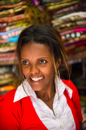 AKSUM, ETHIOPIA - SEP 30, 2011: Portrait of an unidentified Ethiopian woman working on a market in Ethiopia, Sep.30, 2011. People in Ethiopia suffer of poverty due to the unstable situationのeditorial素材