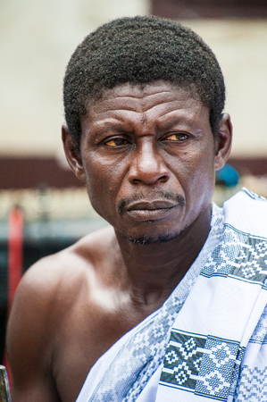 ACCRA, GHANA - MARCH 4, 2012: Unidentified Ghanaian man portrait in Ghana. People of Ghana suffer of poverty due to the unstable economic situationのeditorial素材