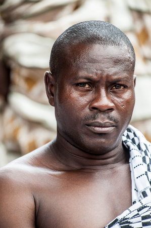ACCRA, GHANA - MARCH 4, 2012: Unidentified Ghanaian man portrait in Ghana. People of Ghana suffer of poverty due to the unstable economic situationのeditorial素材