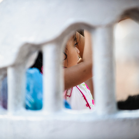 MEXICO CITY, MEXICO - DEC 29, 2011: Unidentified Mexican girl in the street. 60% of Mexican people belong to the Mestizo ethnic groupのeditorial素材