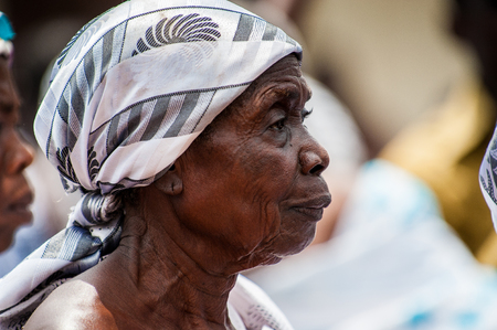 ACCRA, GHANA - MARCH 4, 2012: Unidentified Ghanaian woman portrait in Ghana. People of Ghana suffer of poverty due to the unstable economic situationのeditorial素材