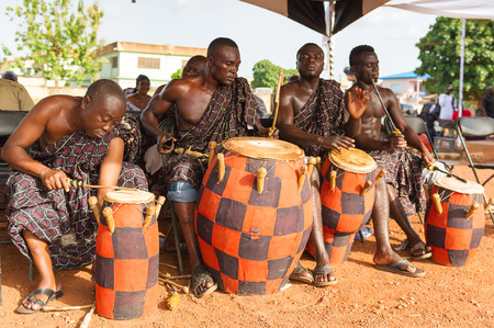 GHANA - MARCH 3, 2012: Unindentified Ghanaian local musicians make the traditional African sounds with the drums in Ghana, on March 3rd, 2012. Music is the main kind of entertainment in Africaのeditorial素材