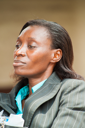 ACCRA, GHANA - MARCH 4, 2013: Portrait of a teacher from one of the Ghanaian schools wearing special uniform in Ghana, Mar 4, 2013. This uniform is one of the ways of humanitarian help to Ghanaのeditorial素材