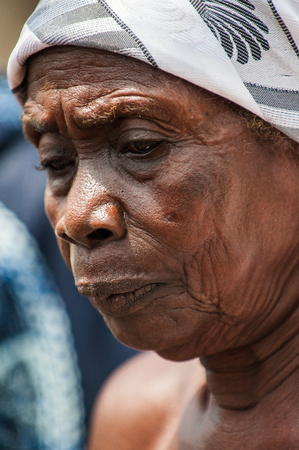 ACCRA, GHANA - MARCH 4, 2012: Unidentified Ghanaian woman portrait in Ghana. People of Ghana suffer of poverty due to the unstable economic situationのeditorial素材
