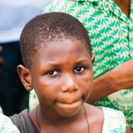 GHANA, ACCRA - MARCH 2, 2012: Portrait of a student  from the Saint Leo International School who came to see the Elmina Castle in Accra, Ghana, on March 2nd, 2012. Children from all faiths may study in the St Leo School.のeditorial素材