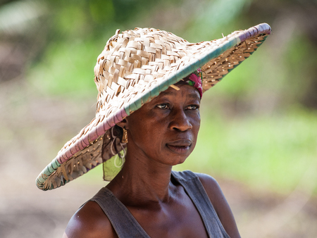 ACCRA, GHANA - MARCH 3, 2012: Unidentified Ghanaian woman portrait in Ghana. People of Ghana suffer...