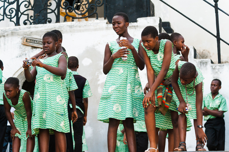 GHANA, ACCRA - MARCH 2, 2012: Student in green uniform from the Saint Leo International School who came to see the Elmina Castle in Accra, Ghana, on March 2nd, 2012. Children from all faiths may study in the St Leo School.のeditorial素材