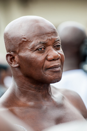 ACCRA, GHANA - MARCH 4, 2012: Unidentified Ghanaian man portrait in Ghana. People of Ghana suffer of poverty due to the unstable economic situationのeditorial素材