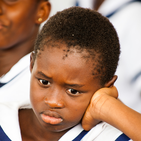 ACCRA, GHANA - MARCH 4, 2013: Portrait of a student from one of the Ghanaian schools wearing special uniform in Ghana, Mar 4, 2013. This uniform is one of the ways of humanitarian help to Ghanaのeditorial素材