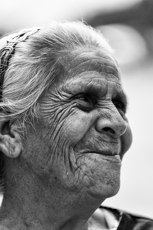 SAN JOSE, COSTA RICA - JAN 6, 2012: Unidentified Costa Rican smiling woman with white hair. 65.8% of Costa Rican people belong to the White (Castizo) ethnic groupのeditorial素材