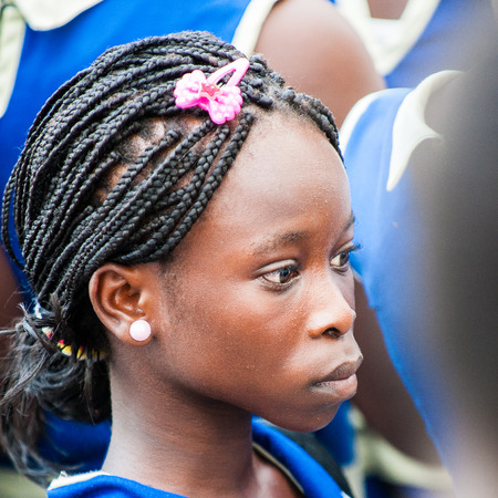 ACCRA, GHANA - MARCH 2, 2012: Unidentified Ghanaian students came to see the Elmina Castle. Children of Ghana suffer of poverty due to the unstable economic situationのeditorial素材
