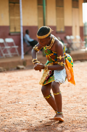GHANA - MARCH 3, 2012: Unindentified Ghanaian girl dances traditional African dance in Ghana, on March 3rd, 2012. Music is the main kind of entertainment in Africaのeditorial素材