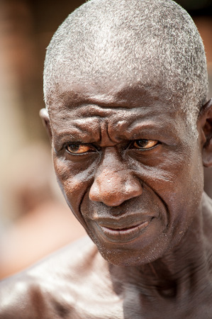 ACCRA, GHANA - MARCH 4, 2012: Unidentified Ghanaian man portrait in Ghana. People of Ghana suffer of poverty due to the unstable economic situationのeditorial素材