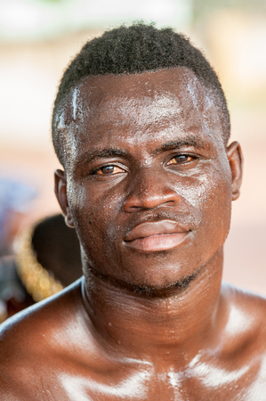 ACCRA, GHANA - MARCH 4, 2012: Unidentified Ghanaian man portrait in the street in Ghana. People of Ghana suffer of poverty due to the unstable economic situationのeditorial素材
