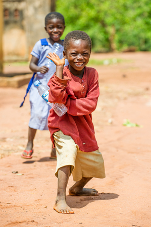 ACCRA, GHANA - MARCH 5, 2012: Unidentified Ghanaian boy smiles in the street in Ghana. Children of Ghana suffer of poverty due to the unstable economic situationのeditorial素材