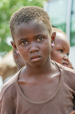 ACCRA, GHANA - MARCH 6, 2012: Unidentified Ghanaian boy in the street in Ghana. Children of Ghana suffer of poverty due to the unstable economic situationのeditorial素材