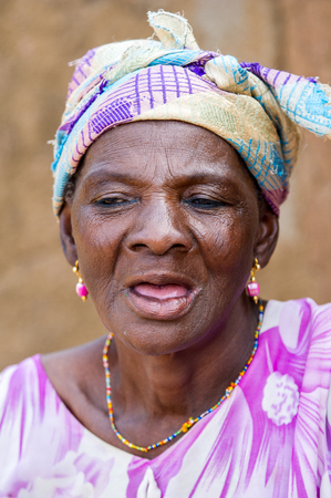 ACCRA, GHANA - MARCH 6, 2012: Unidentified Ghanaian woman portrait in the street in Ghana. People of Ghana suffer of poverty due to the unstable economic situationのeditorial素材