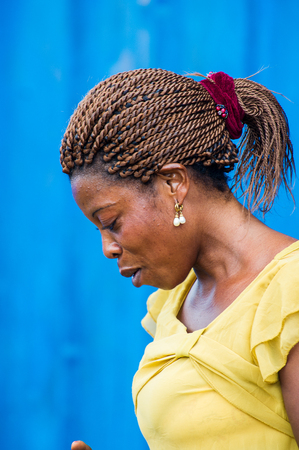 ACCRA, GHANA - MARCH 6, 2012: Unidentified Ghanaian girl in the street in Ghana. Children of Ghana suffer of poverty due to the unstable economic situationのeditorial素材