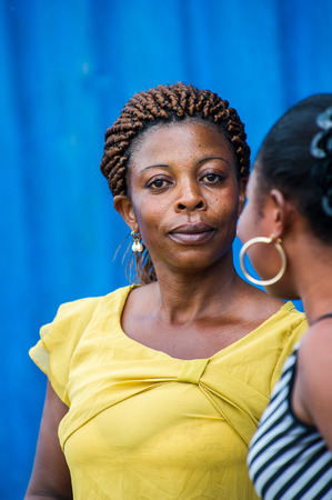 ACCRA, GHANA - MARCH 6, 2012: Unidentified Ghanaian girl in the street in Ghana. Children of Ghana suffer of poverty due to the unstable economic situationのeditorial素材