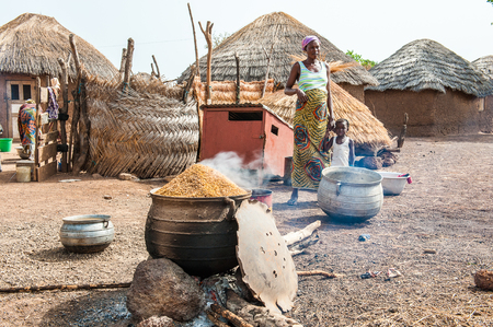 ACCRA, GHANA - MARCH 6, 2012: Unidentified Ghanaian  woman near her house in Ghana. People of Ghana suffer of poverty due to the unstable economic situationのeditorial素材