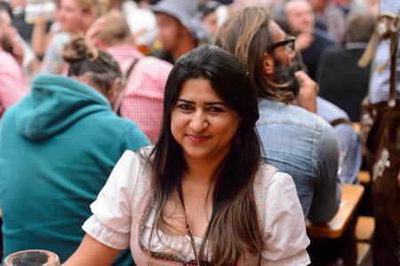 MUNICH, GERMANY - OCT 2, 2017: Unidentified girl in traditional Bavarian costume at the Octoberfest,  the world's largest festivalのeditorial素材