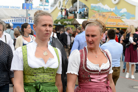 MUNICH, GERMANY - OCT 2, 2017: Unidentified woman in traditional Bavarian costume at the Octoberfest,  the world's largest festivalのeditorial素材