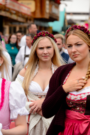 MUNICH, GERMANY - OCT 2, 2017: Unidentified beautiful girl in traditional Bavarian costume at the Octoberfest,  the world's largest festivalのeditorial素材