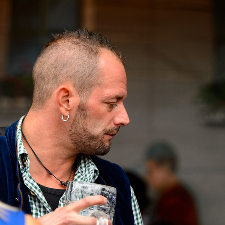 MUNICH, GERMANY - OCT 2, 2017: Unidentified man at the Octoberfest,  the world's largest festivalのeditorial素材