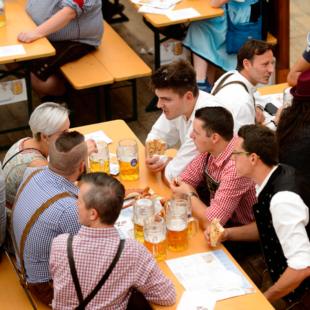 MUNICH, GERMANY - OCT 2, 2017: Unidentified people drink beer at the Octoberfest,  the world's largest festivalのeditorial素材