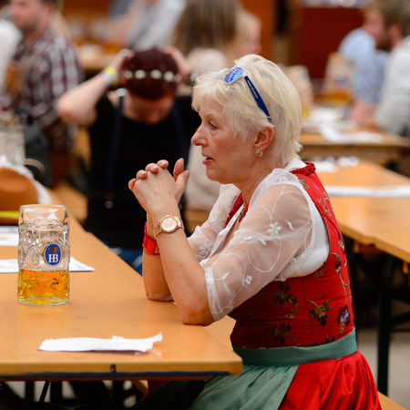 MUNICH, GERMANY - OCT 2, 2017: Unidentified woman in traditional Bavarian costume at the Octoberfest,  the world's largest festivalのeditorial素材