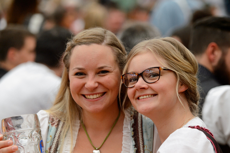 MUNICH, GERMANY - OCT 2, 2017: Unidentified girl in traditional Bavarian costume at the Octoberfest,  the world's largest festivalのeditorial素材