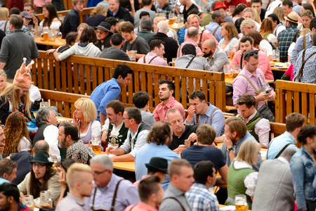 MUNICH, GERMANY - OCT 2, 2017: Unidentified people drink beer at the Octoberfest,  the world's largest festivalのeditorial素材