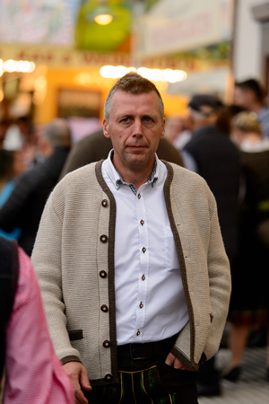 MUNICH, GERMANY - OCT 2, 2017: Unidentified man in traditional Bavarian costume at the Octoberfest,  the world's largest festivalのeditorial素材