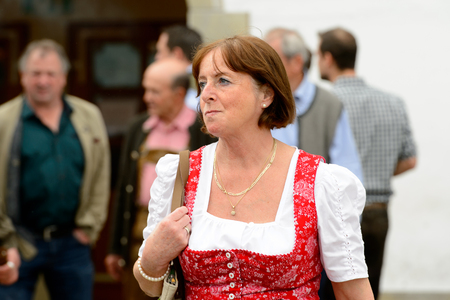MUNICH, GERMANY - OCT 2, 2017: Unidentified woman in traditional Bavarian costume at the Octoberfest,  the world's largest festivalのeditorial素材