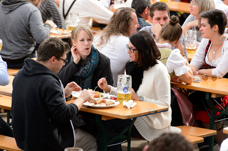 MUNICH, GERMANY - OCT 2, 2017: Unidentified people drink beer at the Octoberfest,  the world's largest festivalのeditorial素材