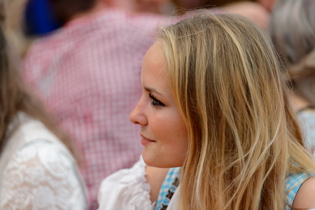 MUNICH, GERMANY - OCT 2, 2017: Unidentified beautiful girl in traditional Bavarian costume at the Octoberfest,  the world's largest festivalのeditorial素材