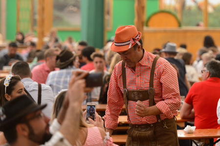 MUNICH, GERMANY - OCT 2, 2017: Unidentified man in traditional Bavarian hat at the Octoberfest,  the world's largest festivalのeditorial素材