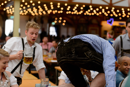 MUNICH, GERMANY - OCT 2, 2017: Unidentified man at the Octoberfest,  the world's largest festivalのeditorial素材
