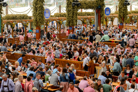 MUNICH, GERMANY - OCT 2, 2017: Unidentified people drink beer at the Octoberfest,  the world's largest festivalのeditorial素材
