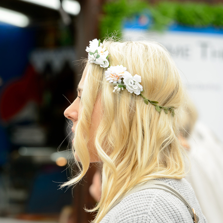 MUNICH, GERMANY - OCT 2, 2017: Unidentified beautiful girl in a daisy chain at the Octoberfest,  the world's largest festivalのeditorial素材