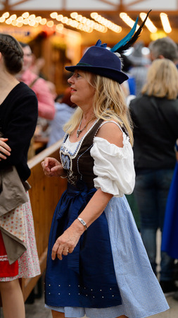 MUNICH, GERMANY - OCT 2, 2017: Unidentified girl in traditional Bavarian costume at the Octoberfest,  the world's largest festivalのeditorial素材