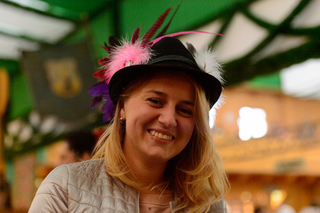 MUNICH, GERMANY - OCT 2, 2017: Unidentified girl in traditional Bavarian hat at the Octoberfest,  the world's largest festivalのeditorial素材