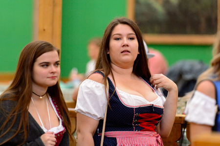 MUNICH, GERMANY - OCT 2, 2017: Unidentified girl in traditional Bavarian costume at the Octoberfest,  the world's largest festivalのeditorial素材